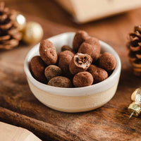 Fèves de cacao enrobées de chocolat au lait
