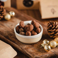Fèves de cacao enrobées de chocolat au lait